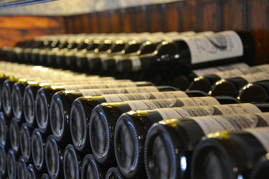 a bunch of bottles of wine are lined up