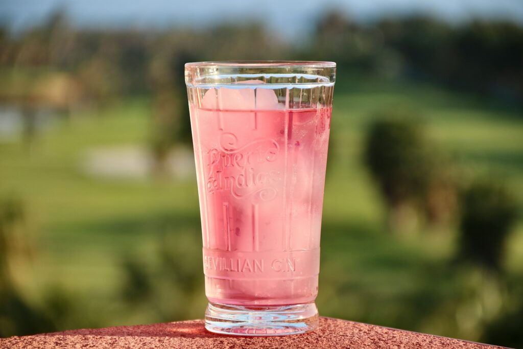 clear drinking glass with red liquid