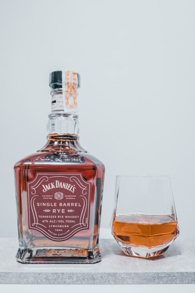 A bottle of jack daniels single barrel and a glass